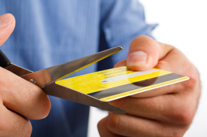 Scissors cutting a credit card